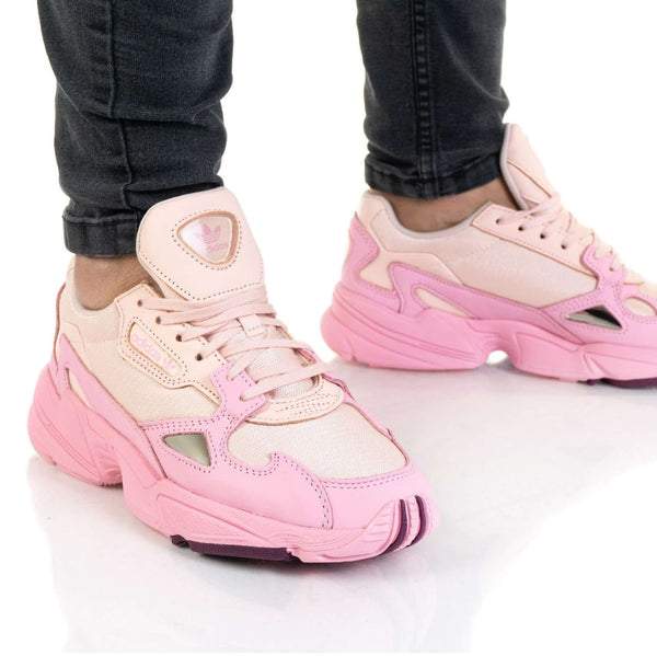 Close-up of adidas FALCON Women EF1994 sneakers in pink, showcasing stylish design and comfort.